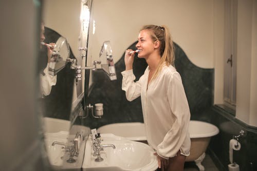 Woman enjoying brushing her teeth