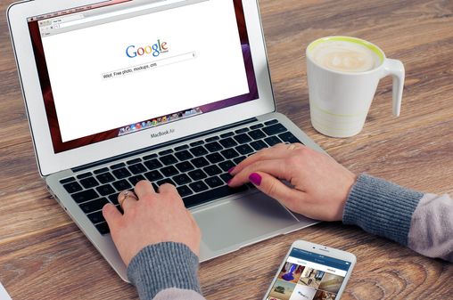 Woman searching Google on her laptop