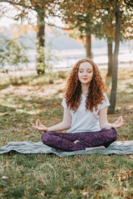 Woman in meditation pose - path of yoga