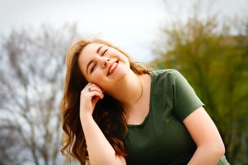 smiling woman who looks comfortable with herself