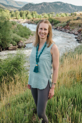 headshot of author in the Colorado mountains