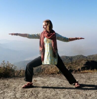 Woman in Warrior 2 pose, a pose of confidence towards a goal