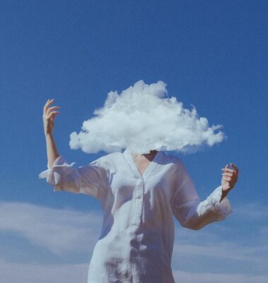 woman in a white tunic with head covered by a cloud, showing confusion