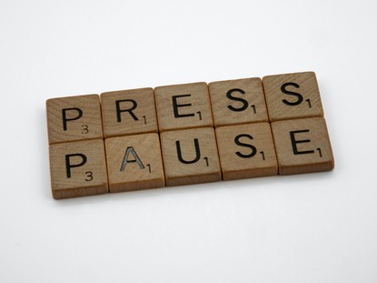 Scrabble pieces spelling press pause