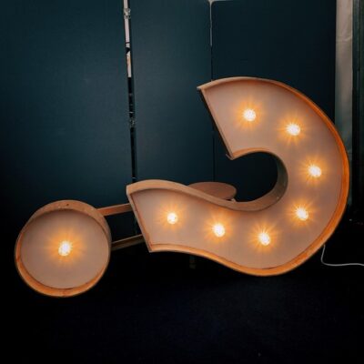 lighted question mark sign on its side