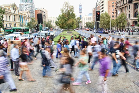 crown of people crossing the street in a blur showing the busyness life has become