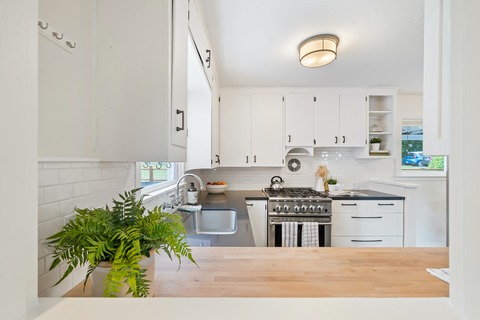 white kitchen cabinets and drawers that are closed