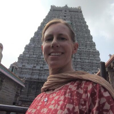 Author in front of the east gate of Tiruvannamalai temple of Shiva representing destroyer of limiting beliefs