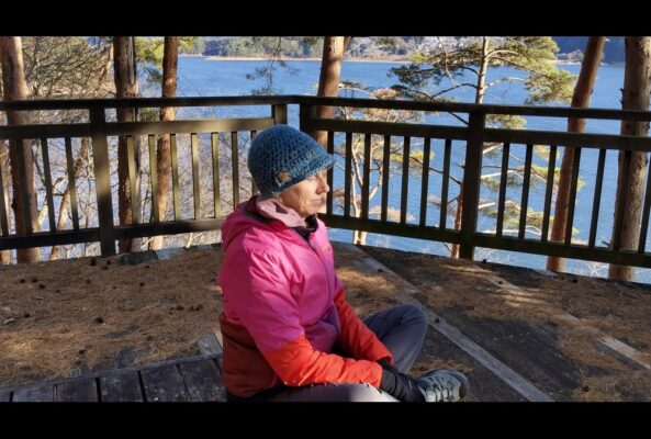 Author siting with eyes closed on a walk practicing self-awareness.