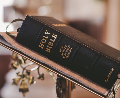 Bible on a stand representing my struggle with the word 'god'