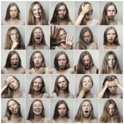 young woman with 25 different emotional expressions showing emotions are always changing