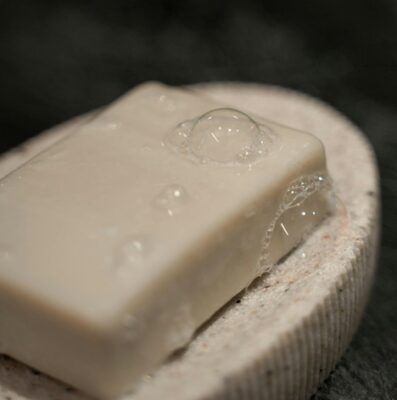 wet bar of soap in a soap dish if you squeeze it to find control it just slips out of your hands