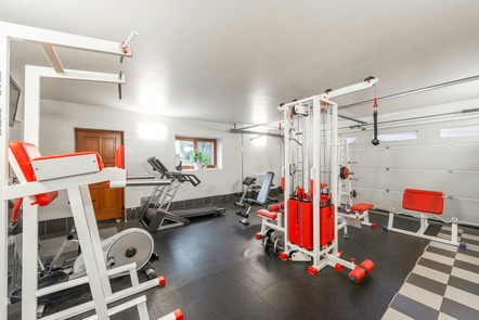 fitness room with weight and fitness machines