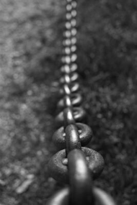 looking up a thick chain representing the hold anger can have on us if not faced