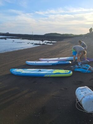 Preparing to paddle and explore the ocean on paddleboards