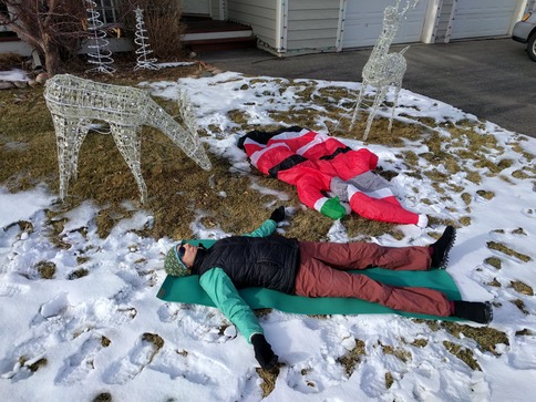 low energy of a person and Santa Claus as they lie on the lawn