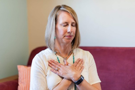 woman with eyes closed and butterfly hands observing her reaction